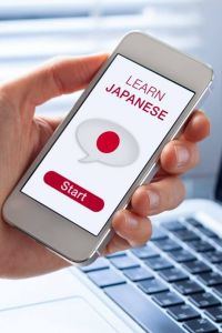 merci en japonais Smartphone dans la main skrivanek
